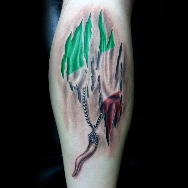 Italian horn pendant tattoo with a ripped-skin effect revealing the tricolor flag, symbolizing deep-rooted heritage and protection.