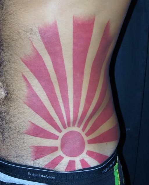Rising Sun Red Ink Mens Lower Ribcage Tattos