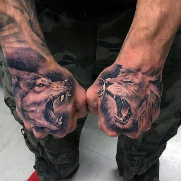 Two fists with tattoos of a snarling wolf and a roaring lion on each hand