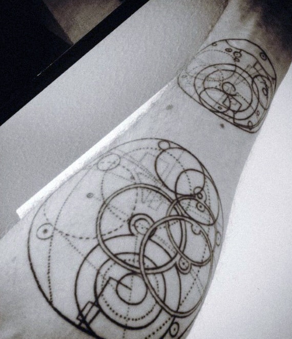 Geometric tattoos on an arm