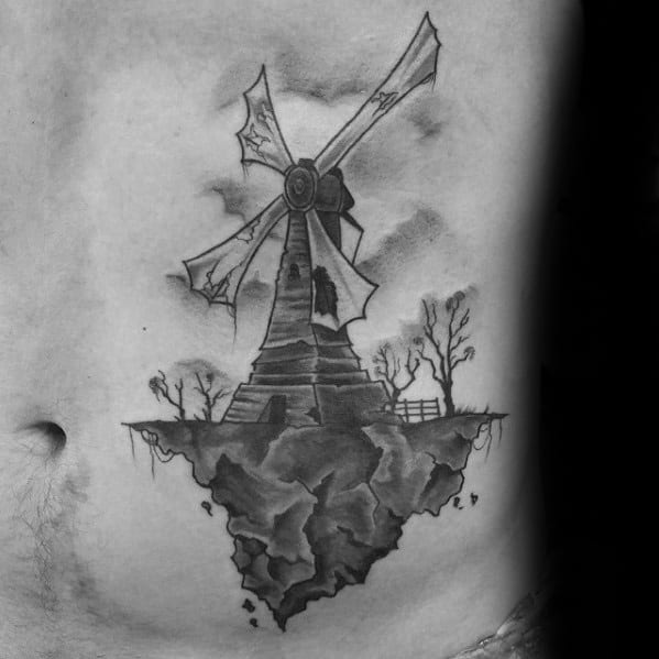 Rock Cliff With Windmill Guys Rib Cage Side Tattoo