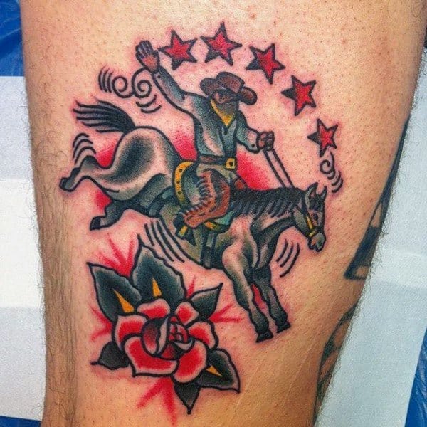 Traditional-style tattoo of a cowboy riding a bucking horse, featuring bold outlines, vibrant colors, red stars, and a rose for a classic Western look.