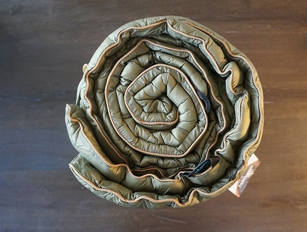 Rolled Up Rumpl Original Puffy Blanket With Color Ends