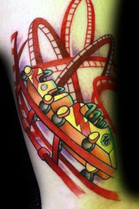 Vibrant roller coaster tattoo with bold red tracks, dynamic loops, and a cartoon-style yellow and orange ride car in motion.