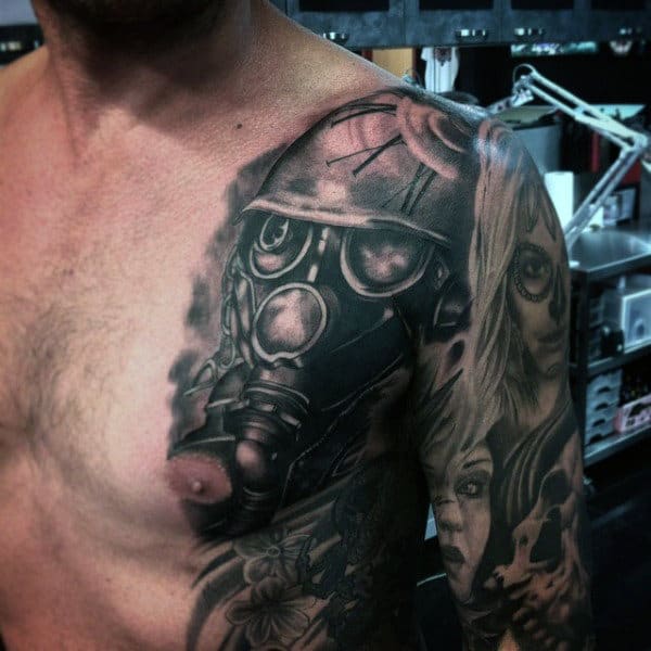 Roman Numeral Gas Mask Tattoo On Mans Shoulder