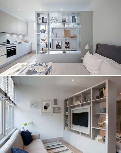 Studio with bookcase divider, cozy bed, modern kitchen, and compact living area.