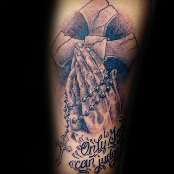 rosary with praying hands and only god can judge me mens forearm tattoo
