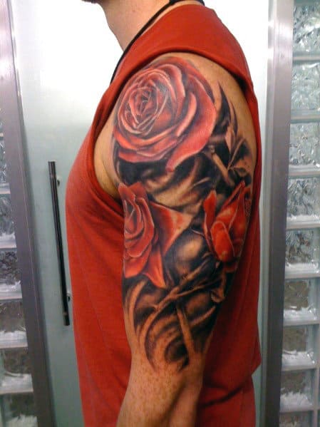 Man with a red rose tattoo sleeve