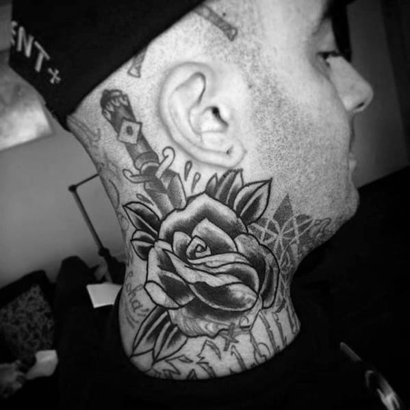 Man with a blast over rose tattoo on his neck, wearing his cap backward