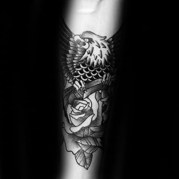 Rose Flower With Bald Eagle Carrying Horseshoe Mens Inner Forearm Tattoo