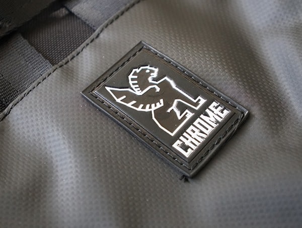 Rubber Chrome Industries Logo Badge On Mens Barrage Cargo Backpack