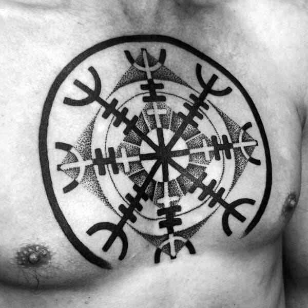 Chest tattoo of a bold black Icelandic Vegvisir compass symbol, made with clean lines and dotwork detailing, representing guidance and protection.