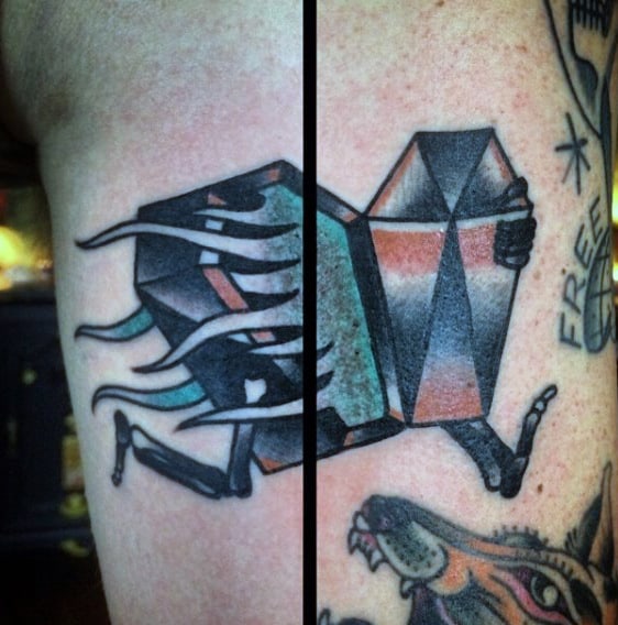 Running Coffin Tattoo Design On Mans Arm