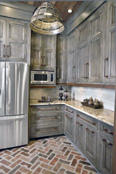 rustic barn wood look kitchen cabinets with subway brick floor