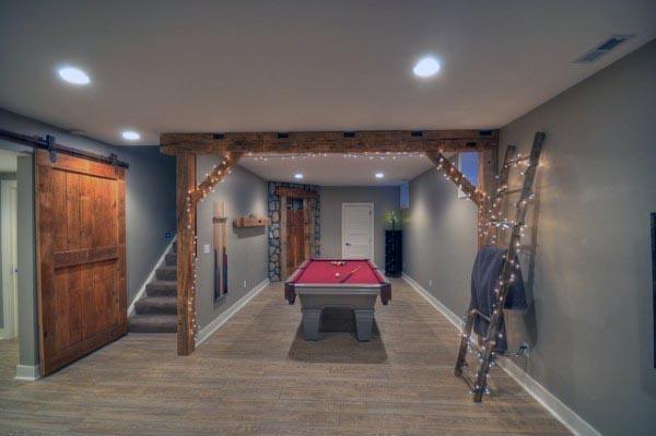 Rustic Basement Lighting With Wood Beams