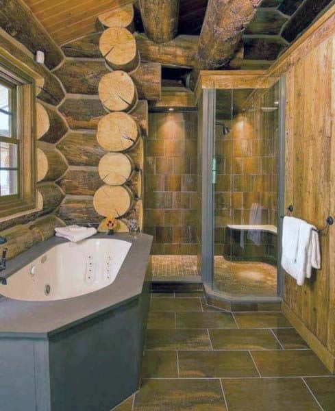 Rustic bathroom with log walls, a corner bathtub, and a sleek glass-enclosed shower