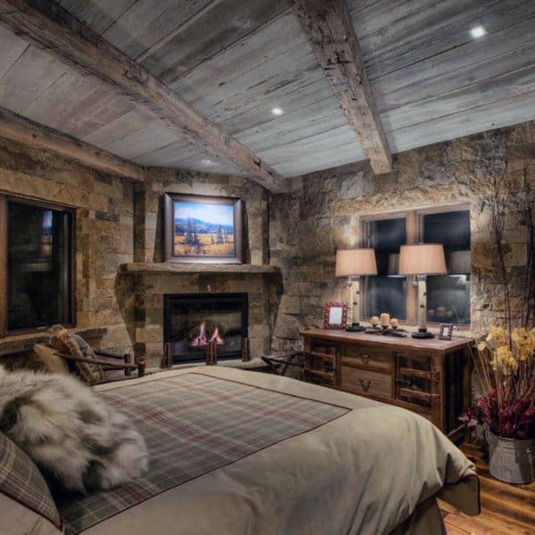 rustic stone bedroom with wood ceiling