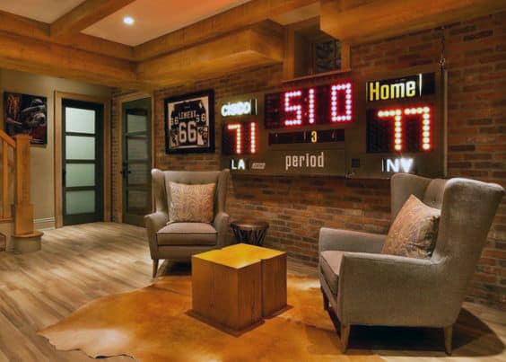 rustic brick wall scoreboard man cave games room gray lounge chairs 