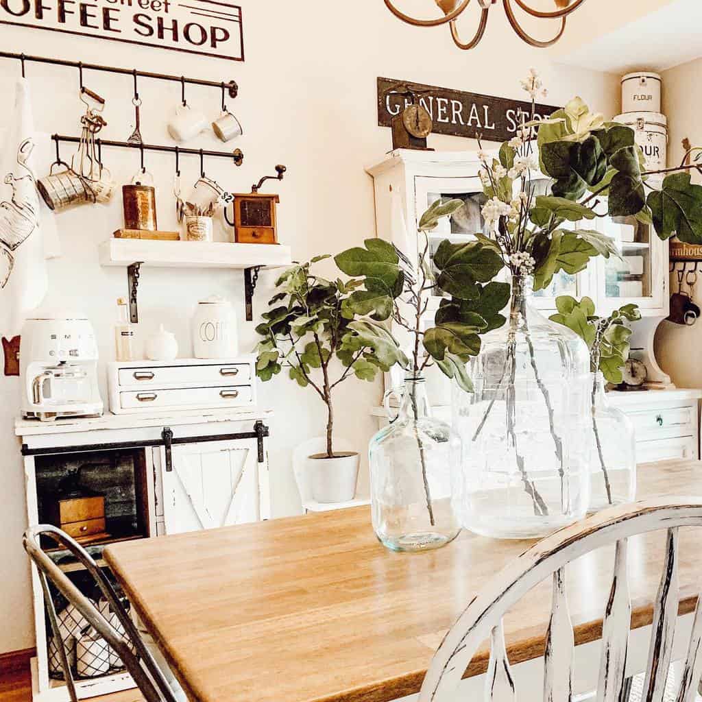 rustic dining room white cabinets wood table and chairs glass jar vases 