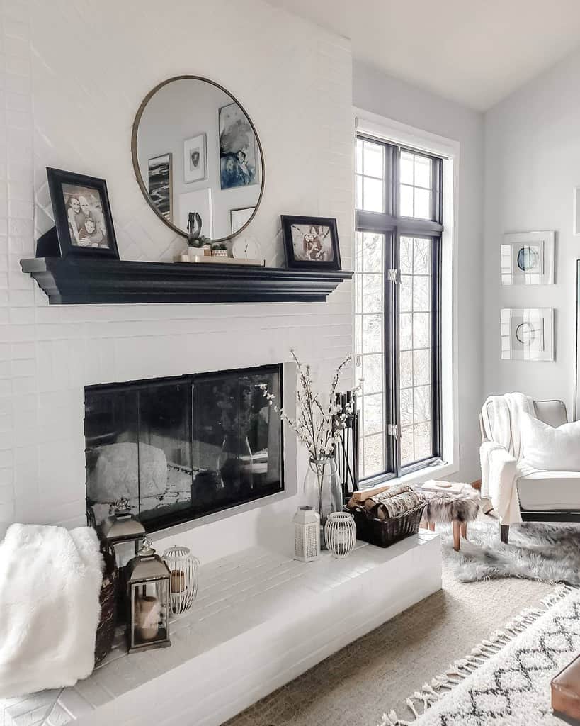 white living room with black accents brick fireplace lounge chair