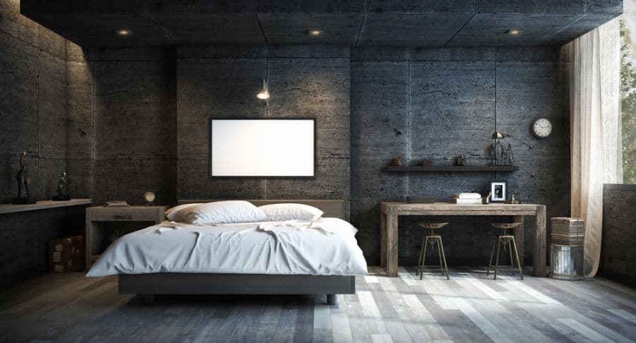 Industrial-style bedroom with dark walls, wooden desk, and minimalist decor.