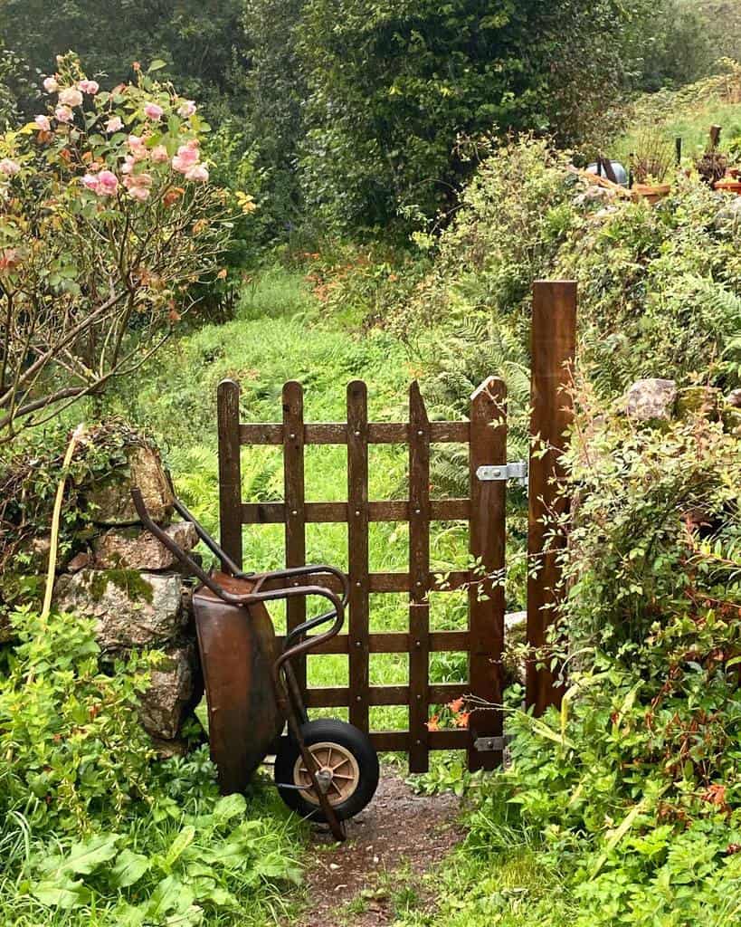 small rustic garden gate wheelbarrow