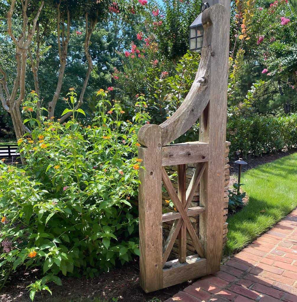rustic wood garden gate brick pavers