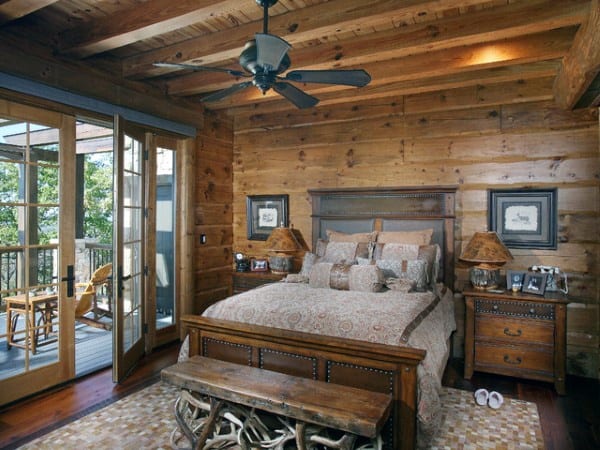 wood panel bedroom with bed and bench