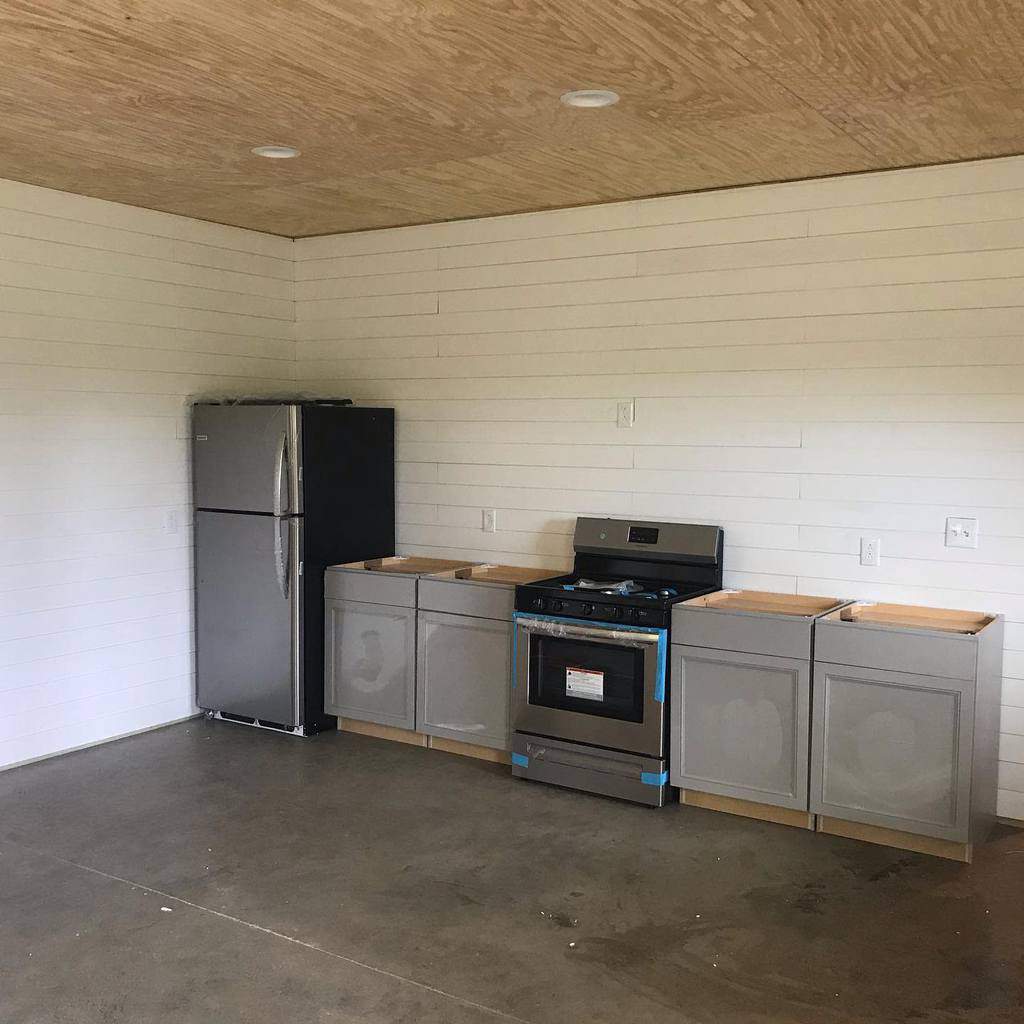 minimalistic unfinished basement kitchen