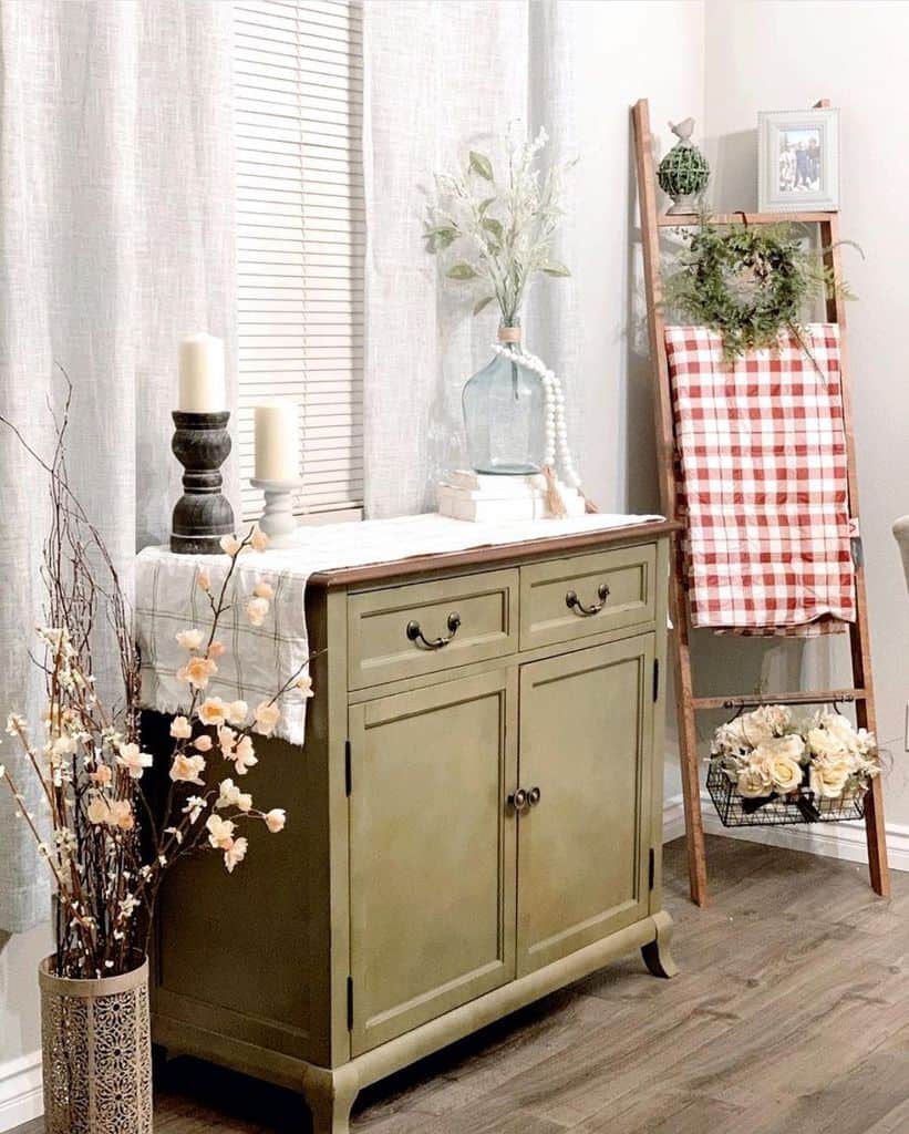 vintage cabinet and rustic ladder decor