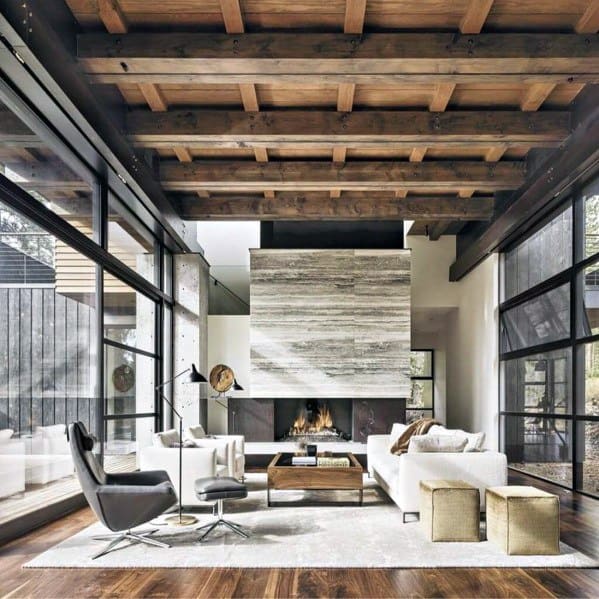 A rustic barn wood ceiling with heavy beams adds warmth to this modern living room.