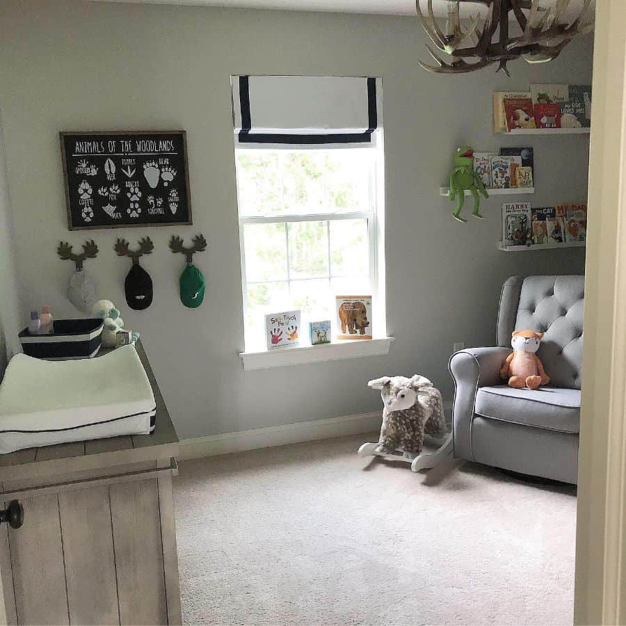 kids nursery gray longe chair wall shelves rocking chair wood cabinet