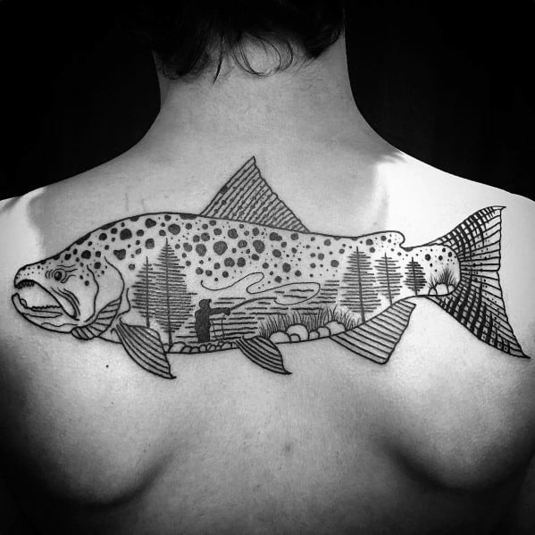 Black and grey back tattoo of a detailed salmon with a scenic forest and river landscape inside its body, symbolizing nature and adventure.