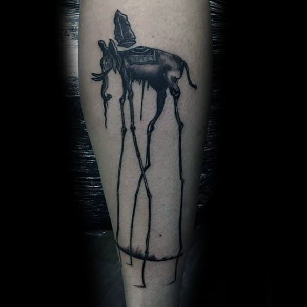 Dark surreal Salvador Dali-style tattoo of an elephant with dripping details, elongated legs, and a shaded obelisk on its back, inked on the calf.