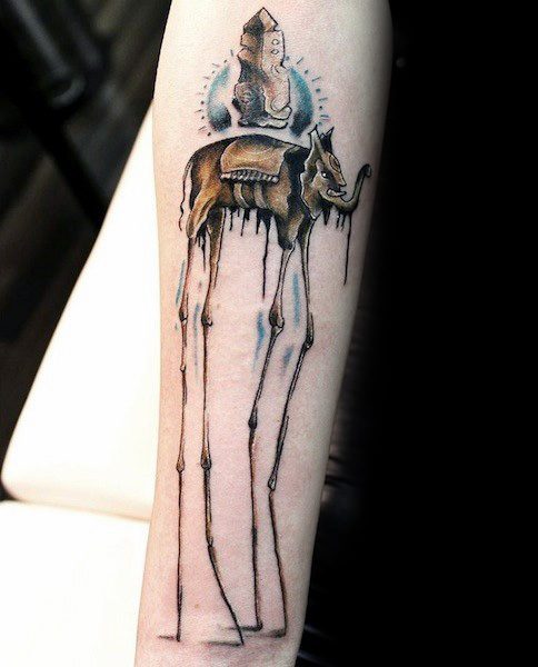 Color surrealist tattoo of a Salvador Dali-style elephant with elongated legs, carrying an ornate obelisk, set against a glowing circular backdrop.