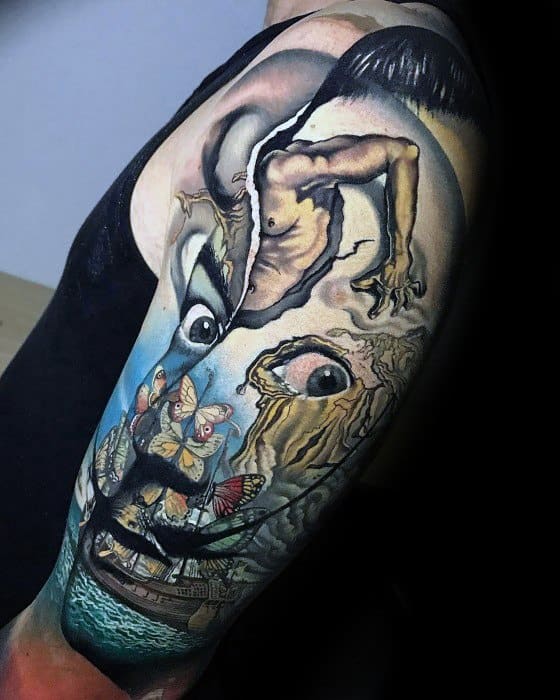 Surrealist half-sleeve tattoo inspired by Salvador Dali, merging distorted faces, butterflies, and dreamlike landscapes in vibrant, painterly detail.
