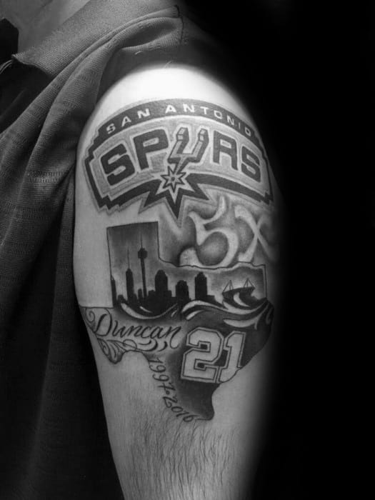 Black and gray San Antonio Spurs tattoo featuring the logo, 5X championship, skyline, Texas outline, and Tim Duncan’s name and number 21.