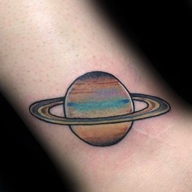 Colorful Saturn tattoo design for men with soft gradient hues of blue, orange, and brown, featuring clean black outlines and classic rings.