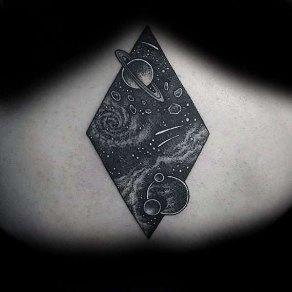 Diamond-shaped Saturn tattoo design for men with starry galaxies, planets, and meteor trails in detailed blackwork and dot shading.