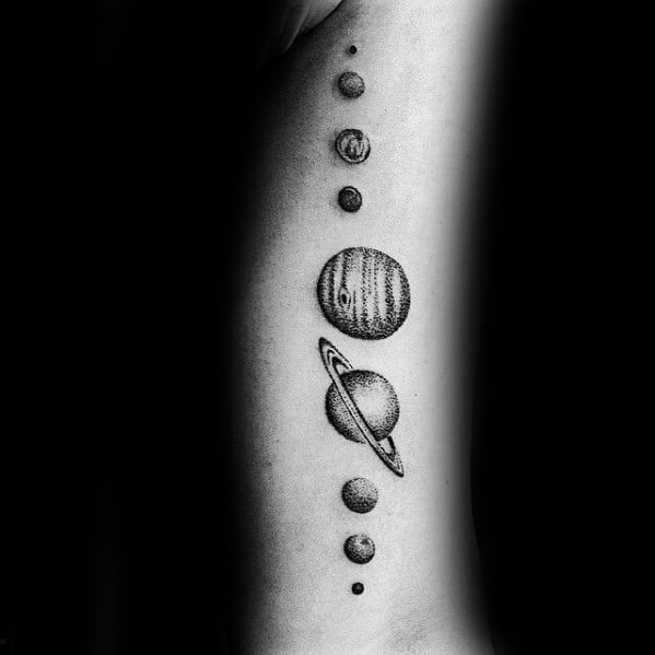 Dotwork solar system tattoo design for men with detailed planets in vertical alignment, featuring Saturn with bold rings at the center.