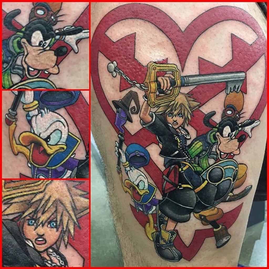 Colorful Kingdom Hearts tattoo featuring Sora, Donald, and Goofy in action poses with a Keyblade, set against a bold red Heartless emblem.