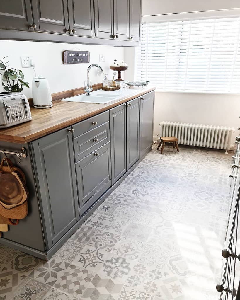 scandinavian galley kitchen gray cabinets small wood stool pattern design flooring