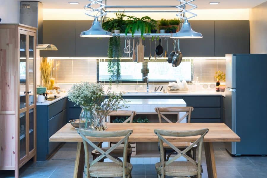blue cabinet open kitchen with wood table