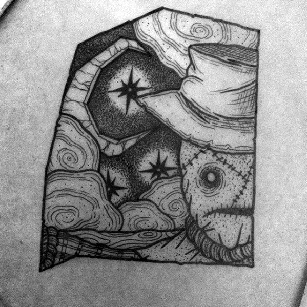 Whimsical linework scarecrow tattoo with a stitched face, top hat, swirling clouds, crescent moon, and stars in a starry night sky.