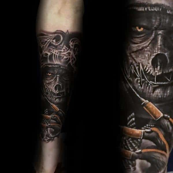 Dark scarecrow tattoo with glowing eyes, stitched mouth, and sinister syringe-filled glove, featuring smoke and shading on the forearm.