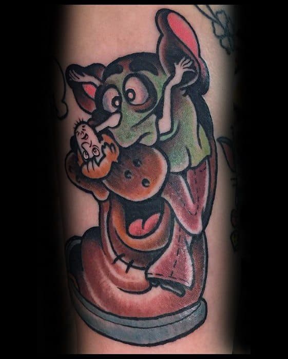 Cartoon-style tattoo of Scooby-Doo disguised as a vampire, holding a Scooby Snack with a playful and exaggerated expression.