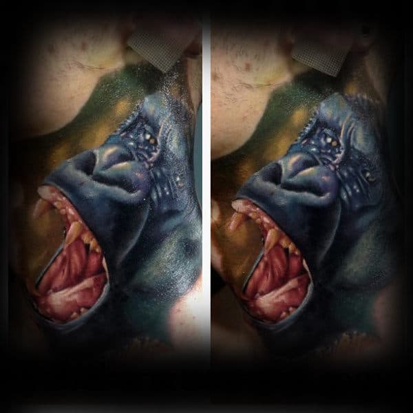 Realistic throat tattoo of a roaring gorilla with sharp teeth and intense shading, creating a fierce and dramatic effect