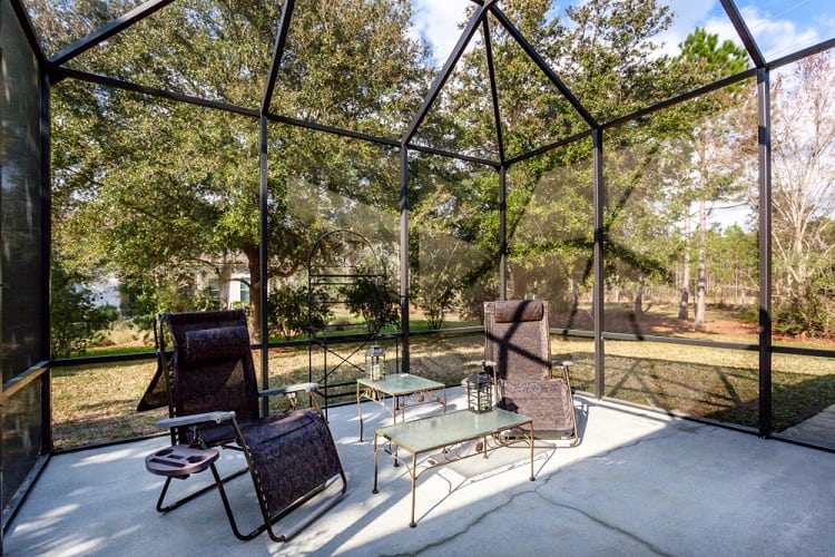Screened In Porch With Comfortable Chairs