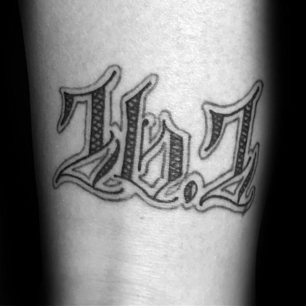 Gothic-style “26.2” tattoo in bold blackletter font, symbolizing strength, grit, and the pride of conquering a marathon distance.