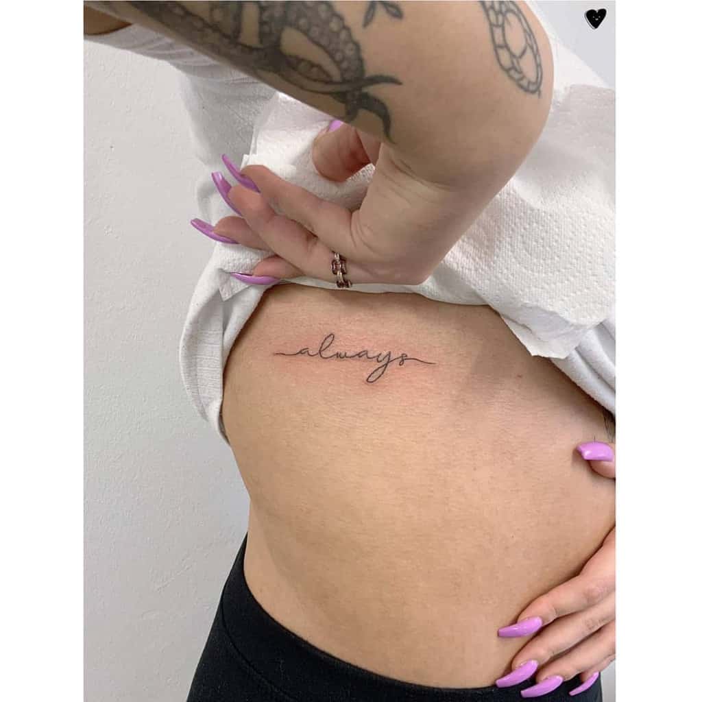 Tattoo of the word "always" on woman's side